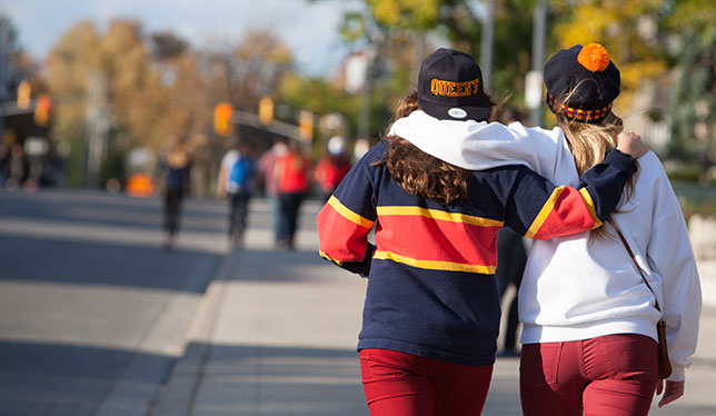 Ladies walking on footpath