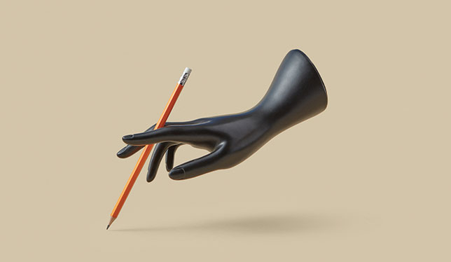 A plastic hand holding a pencil.