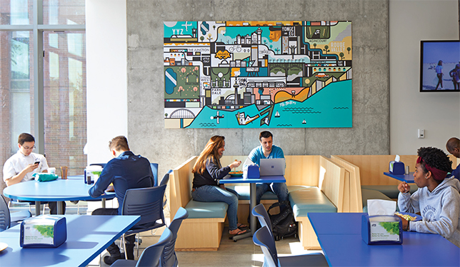 Students relax in a lounge at the CampusOne student residence in downtown Toronto