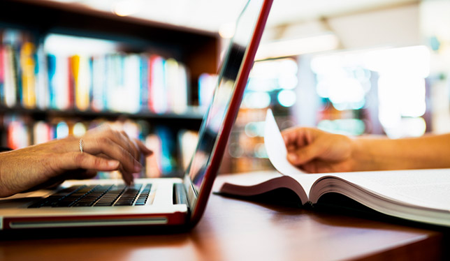 Laptop and Book on Table