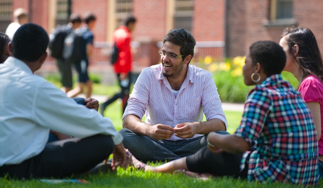 students sitting outside